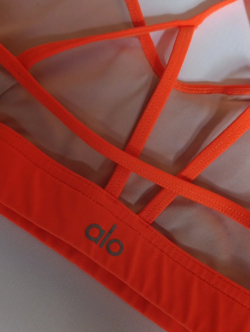 ALO Yoga White Bralette with Bright Coral Trim and Cross-Back Straps